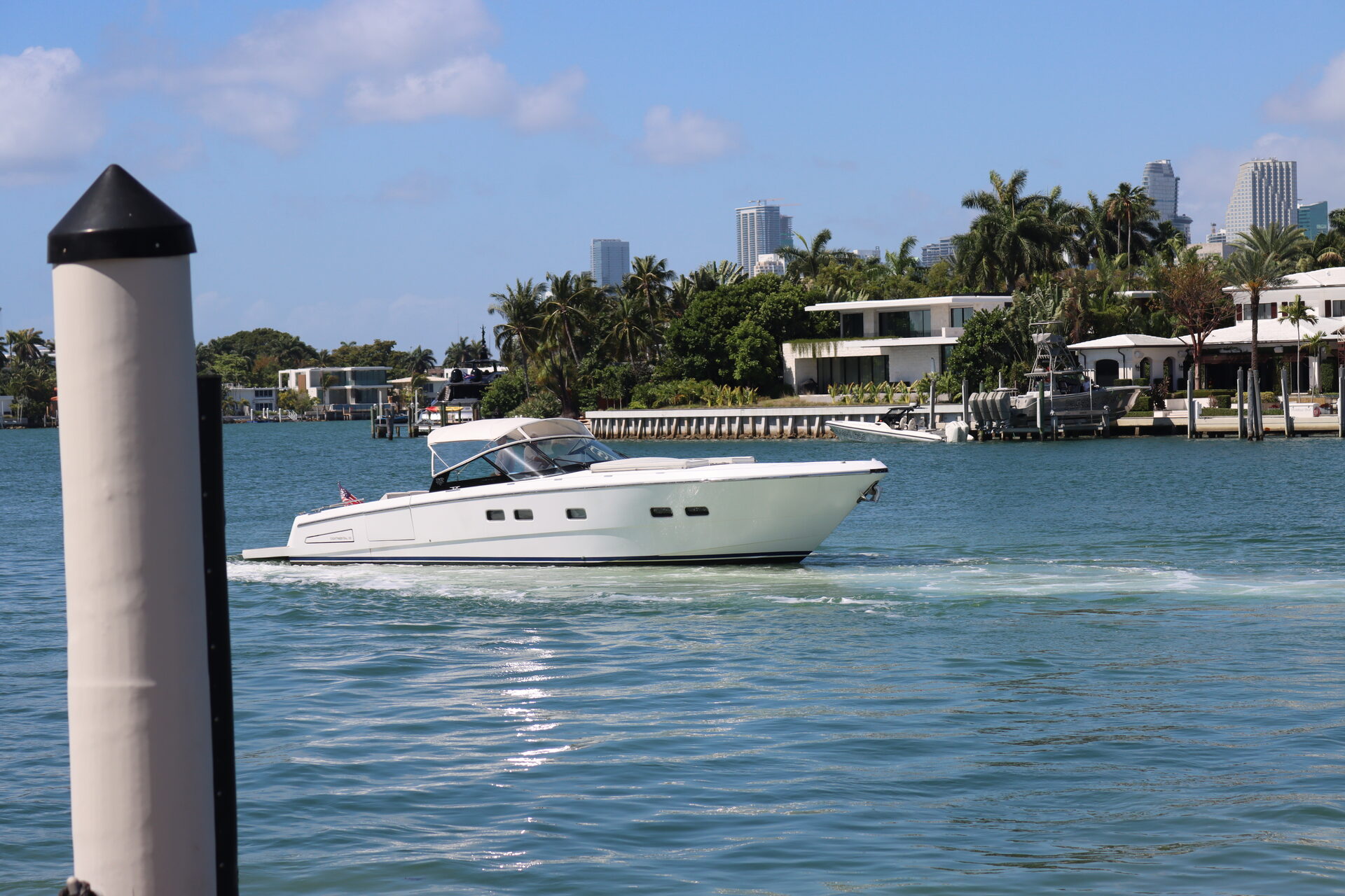 Helm with Miami skyline visible through windscreen